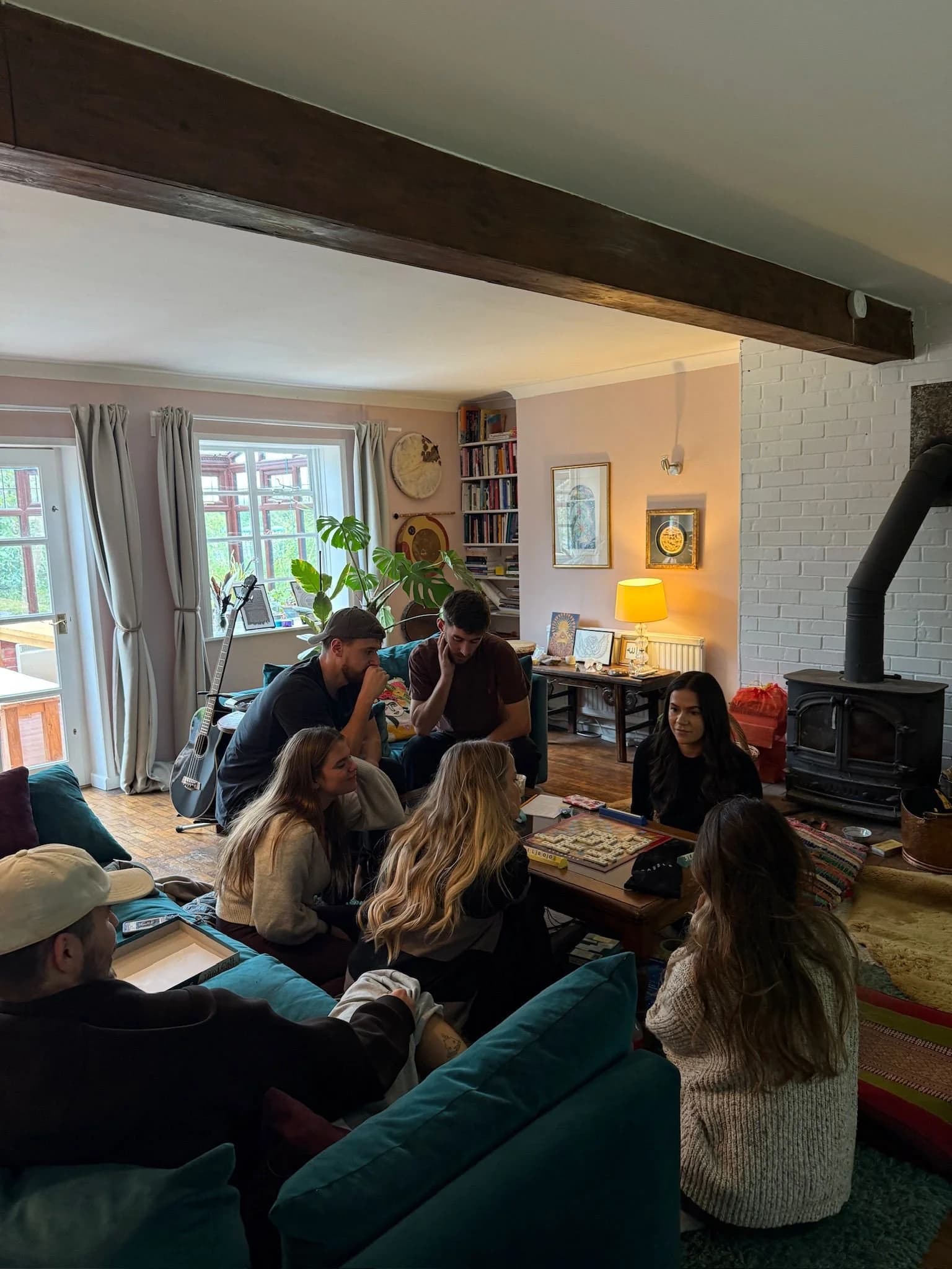 Young adults gathered around the hearth